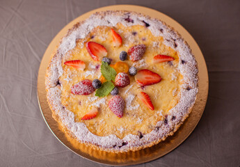 Cottage cheese pie, decorated with berries.
