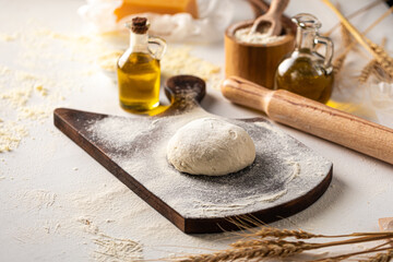 Fototapeta premium Preparation of dough with flour for kneading pizza cooking