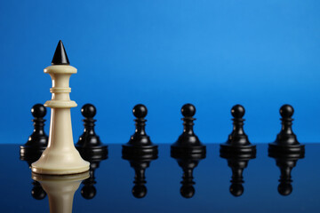 king chess leads the other pieces. The concept of leadership. Low depth of field