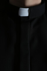 Priest wearing cassock with clerical collar, closeup view - obrazy, fototapety, plakaty