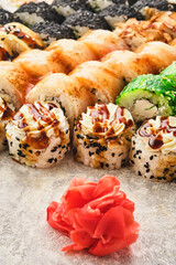 Japanese cuisine, traditional sushi rolls. Different colorful sushi. Close-up