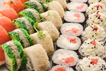 Assortment Sushi Roll Set, top view, close-up. Hosomaki, uramaki, gunkan.