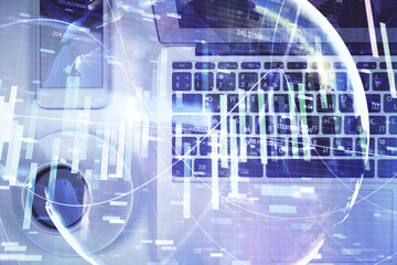 Business theme hologram drawings over computer on the desktop background. Top view. Multi exposure. Concept of international connections.