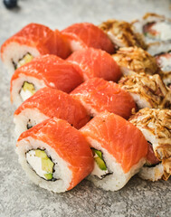 Sushi set. Uromaki with Philadelphia, with vegetables and fish