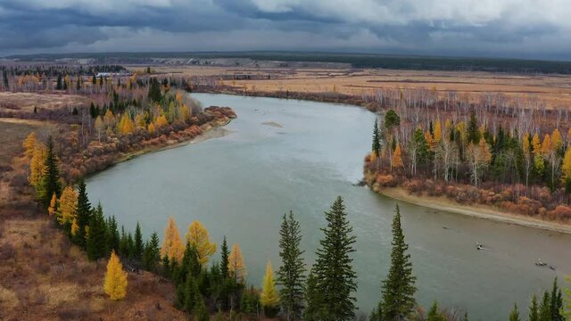 Eastern Sayans in autumn. Tunka valley before the rain. Irkut River.
