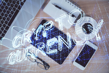 Double exposure of blockchain theme hologram over table with phone. Top view. Crypto technology...