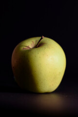 Green Apple on black background