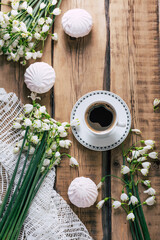 Snowdrops and coffee on a wooden table