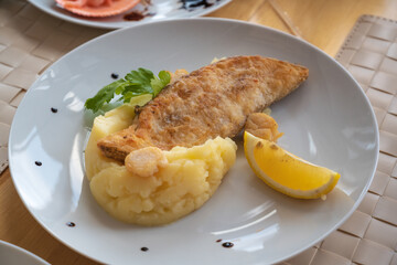 Delicious Russian dishes, mashed potatoes with salmon and lemon.