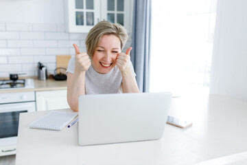 emotional woman working on laptop