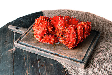 Spiny crab on a wooden server board. 