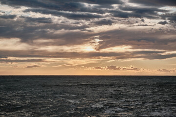 Scenic view of clouds over the sea during sunset