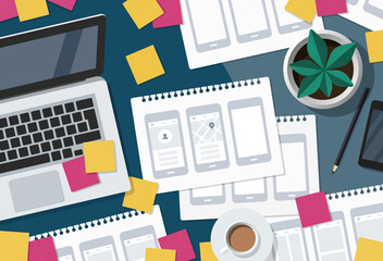 Flat lay illustration of a busy UX UI designer desk with mobile app wireframe sketches and sticky notes.
