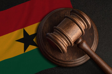 Judge gavel and flag of Ghana. Law and justice in Ghana. Violation of rights and freedoms