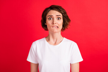 Portrait of attractive desperate worried girl bed news expect reaction biting lip isolated over...