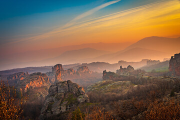 Dramatic sunset over the beautiful canyon like geological park in Belogradchik, Bulgaria 