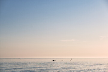 Scenic view of  some fishermen  during a beautiful sunrise 