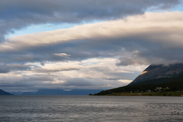 Naklejka na ściany i meble View of clouds and mountains over the sea in Norway