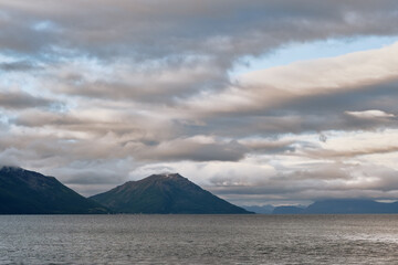 Fototapeta premium View of clouds and mountains over the sea in Norway