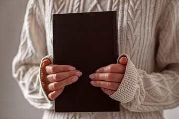 Woman holding book