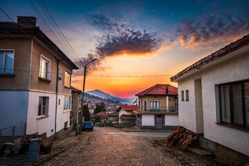 Sunset over the rural houses in Belogradchik, Bulgaria 