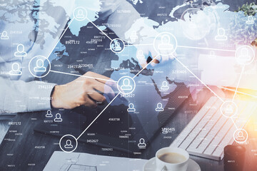 Double exposure of man's hands holding and using a phone and social network theme drawing.