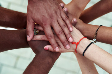 Black people with hands joined. Group of people stacking hands together