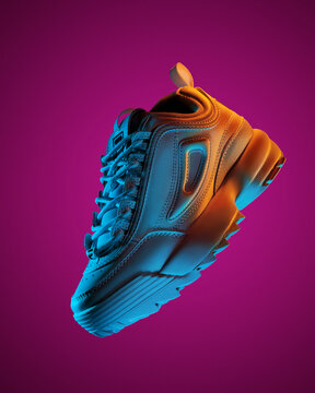 floating fashion sneakers in neon lights