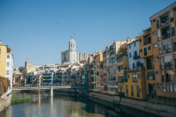 A boat in the water with a city in the background
