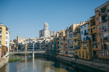A bridge over water with a city in the background