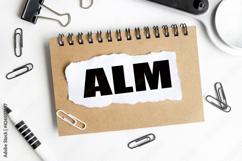Poster alm. word alm conceptual symbol. text on white notepad paper on light background