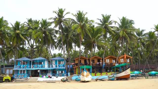 Colorful bungalows on the tropical beach of Palolem, beachfront resort
