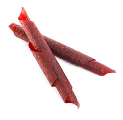 Delicious fruit leather rolls on white background, top view