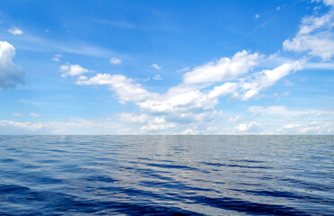 Perfect blue sky with clouds and water of the sea