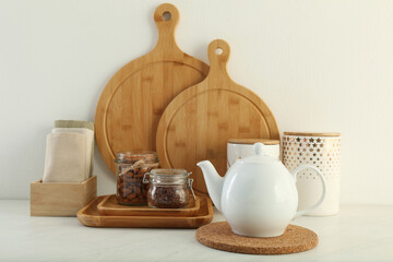 Fototapeta na wymiar Modern kitchenware and products on white marble table