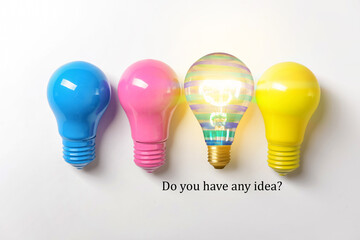 Colorful light bulbs on white background