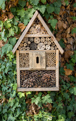 Small wooden house for insects in garden