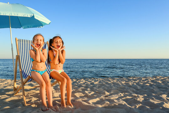 Cute little girls on sea beach