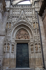 Fototapeta na wymiar Bell's door at the cathedral of Santa María, is a Roman Catholic cathedral in Seville, Andalusia, Spain. It is the largest Gothic church and was registered by UNESCO as a World Heritage Site. 