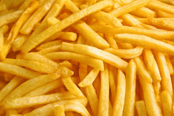 Heap of tasty french fries as background