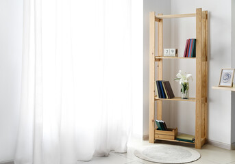 Modern interior with shelf unit and books in room