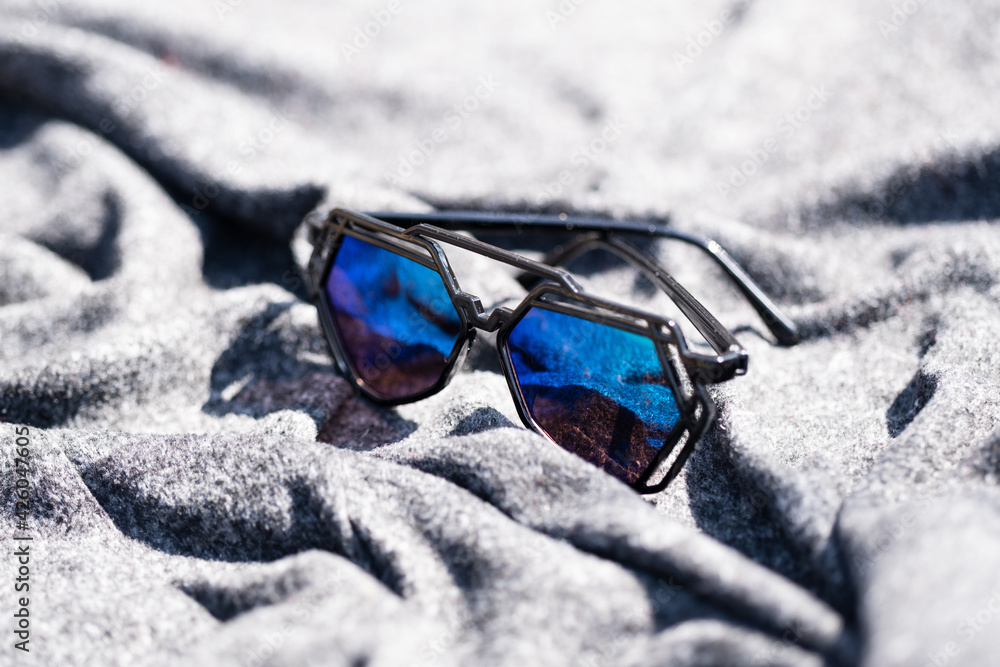 Wall mural Futuristic sunglasses design with big green lenses closeup shoot outside in a summer day . Selective focus. High quality photo