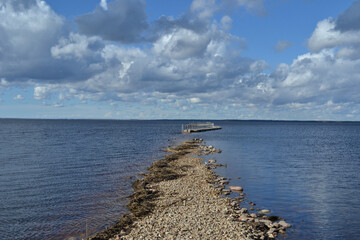 landscape with a lake, which in the spring floods flooded a wooden footpath immersed in river...