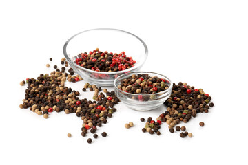Bowls with mixed peppercorns on white background