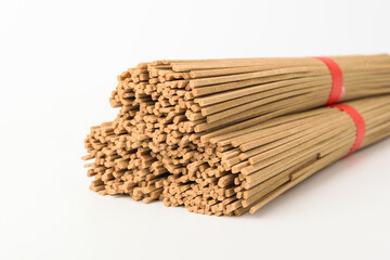 Buckwheat noodles on a white background