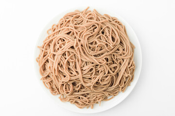 Buckwheat noodles on a white background