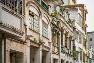 Fototapeta premium Details of facade of old colonial sotto portico buildings in Xinmin west road Haikou Qilou old town Hainan China