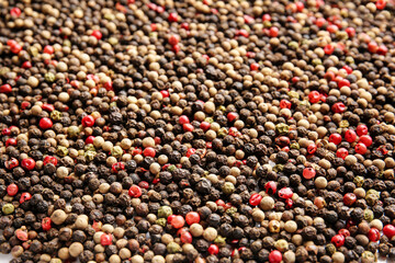 Mixed peppercorns as background, closeup