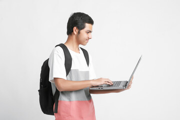 indian male college student using laptop