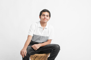young indian boy showing expression on white background